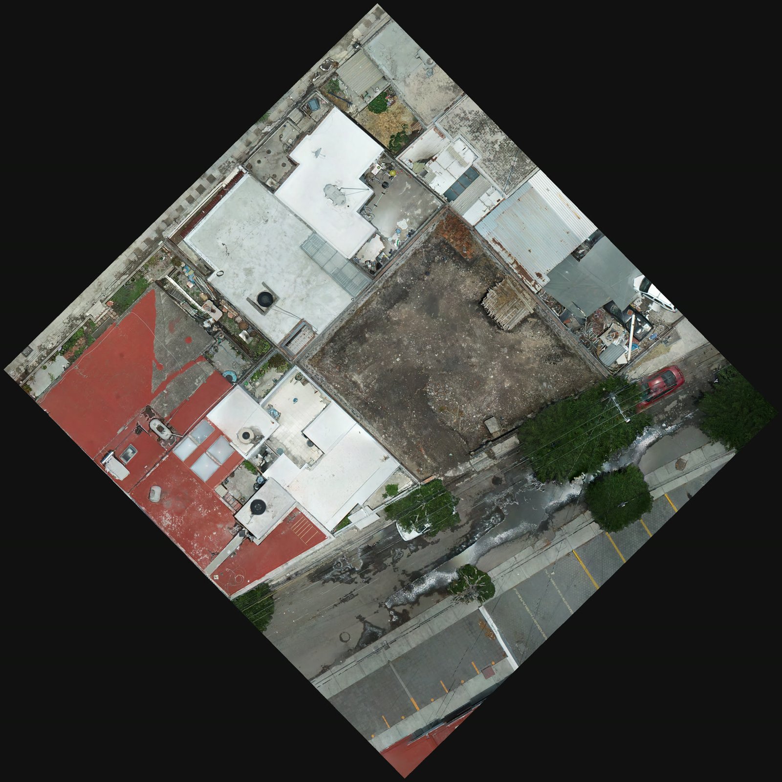 E9 — ortomosaico del predio y la manzana levantado con dron antes de iniciar la obra